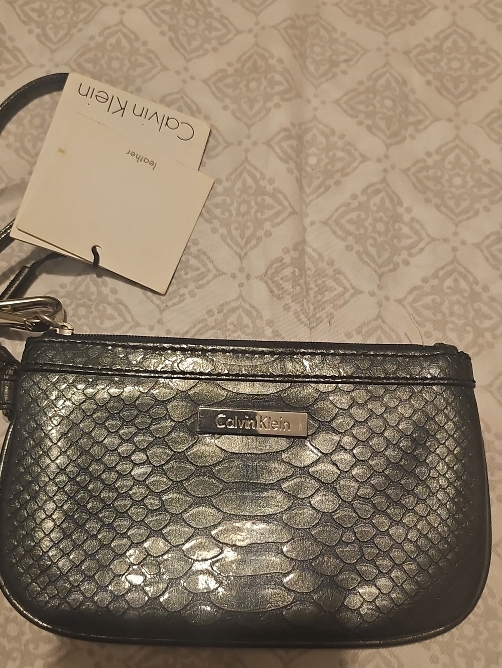 Calvin Klein Silver Snake-Embossed Wristlet